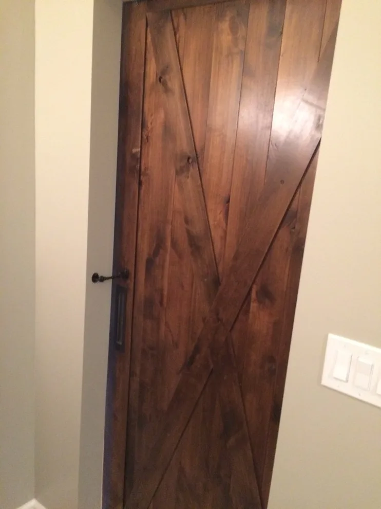 Bathroom featuring a sliding barn door by Embark Project Services, LLC - Photo 16
