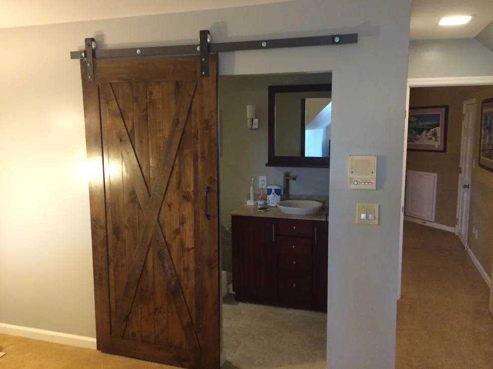 Bathroom featuring a sliding barn door by Embark Project Services, LLC - Photo 3