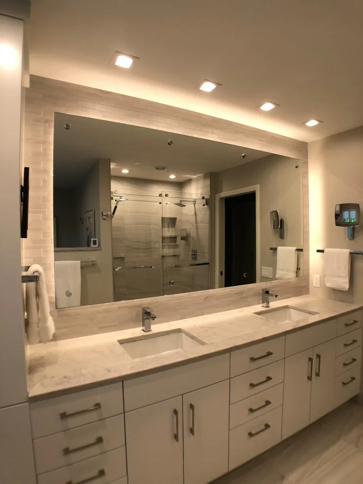 Bathroom renovation featuring a lighted mirror, heated flooring, and additional enhancements by D & L Construction - Photo 3