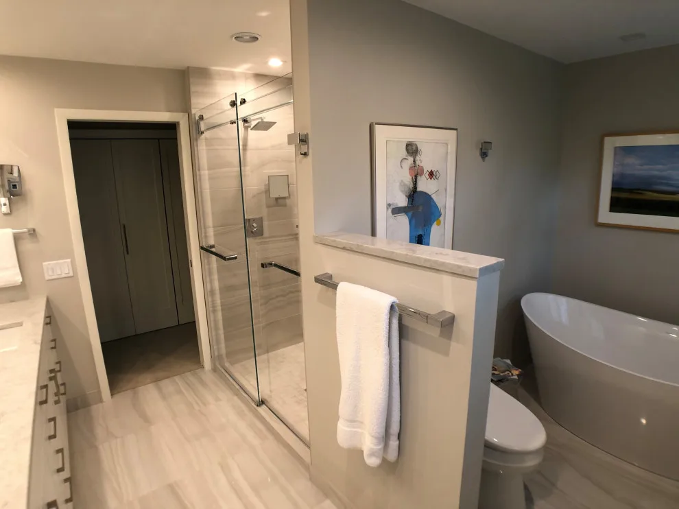 Bathroom renovation featuring a lighted mirror, heated flooring, and additional enhancements by D & L Construction - Photo 2