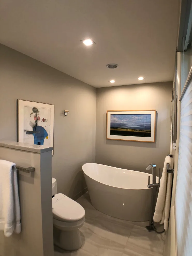 Bathroom renovation featuring a lighted mirror, heated flooring, and additional enhancements by D & L Construction - Photo 5