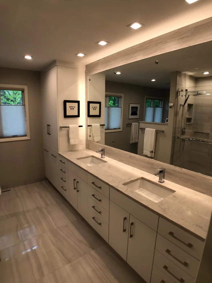 Bathroom renovation featuring a lighted mirror, heated flooring, and additional enhancements by D & L Construction - Photo 4