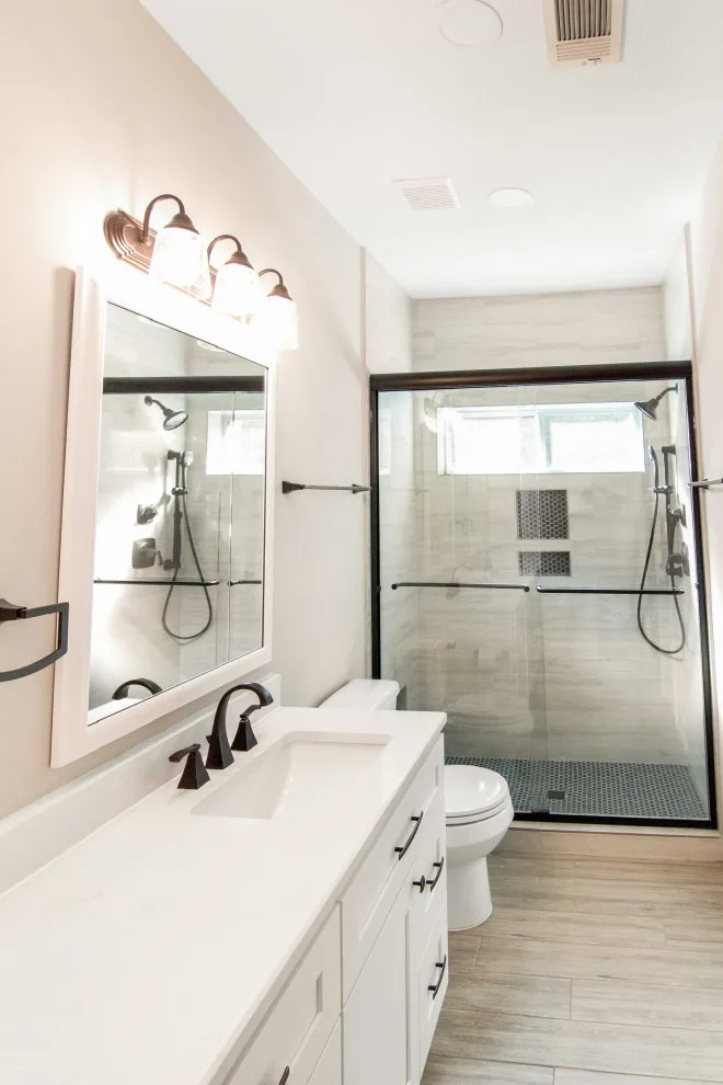 Restrooms by Anderson Remodeling - Photo 16