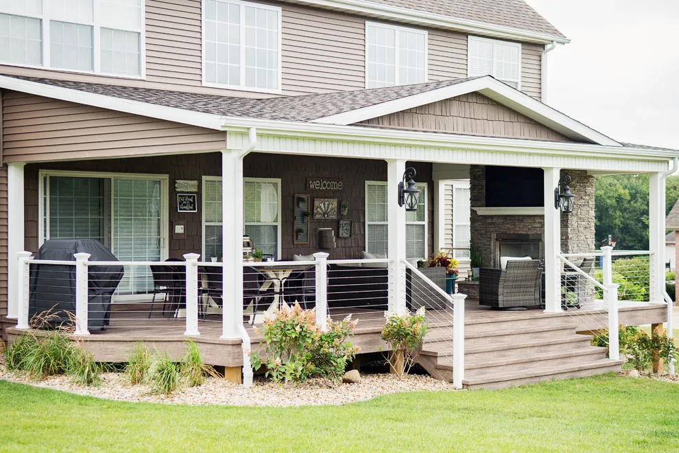 Stunning Exterior Transformation with Spacious Covered Deck and Fireplace by Cooper Construction And Restoration, Inc. - Photo 5