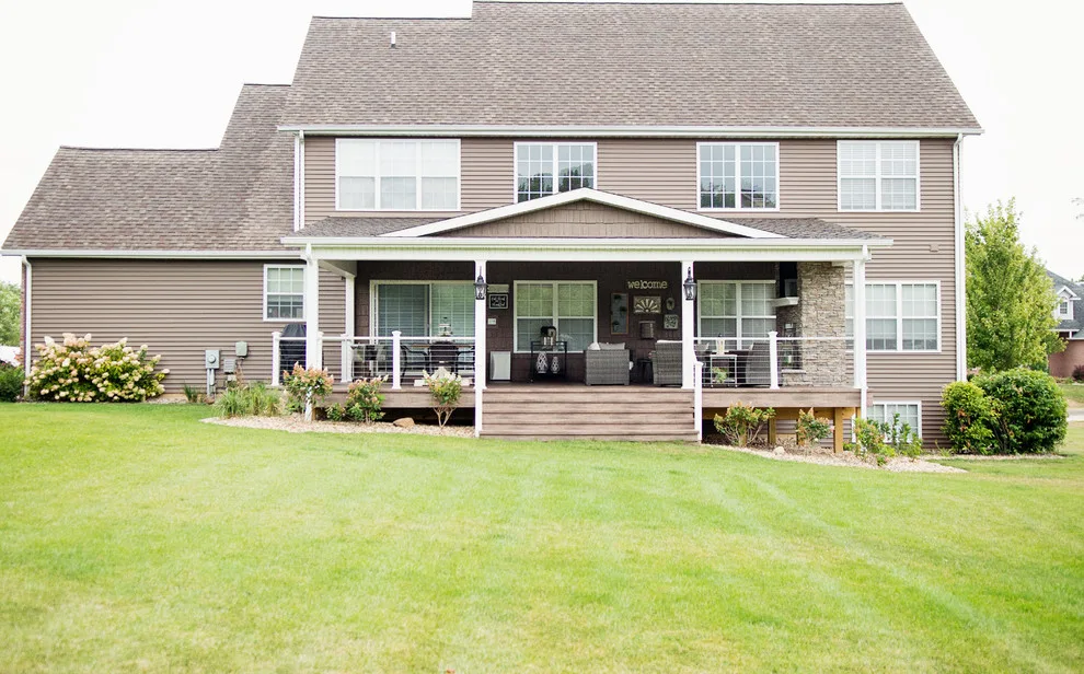 Stunning Exterior Transformation with Spacious Covered Deck and Fireplace by Cooper Construction And Restoration, Inc. - Photo 7