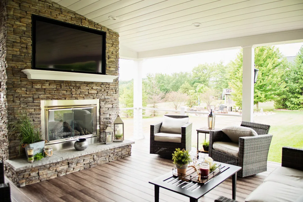 Stunning Exterior Transformation with Spacious Covered Deck and Fireplace by Cooper Construction And Restoration, Inc. - Photo 12
