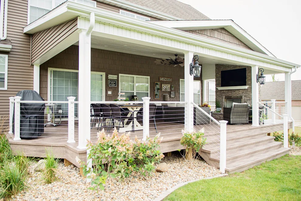 Stunning Exterior Transformation with Spacious Covered Deck and Fireplace by Cooper Construction And Restoration, Inc. - Photo 11