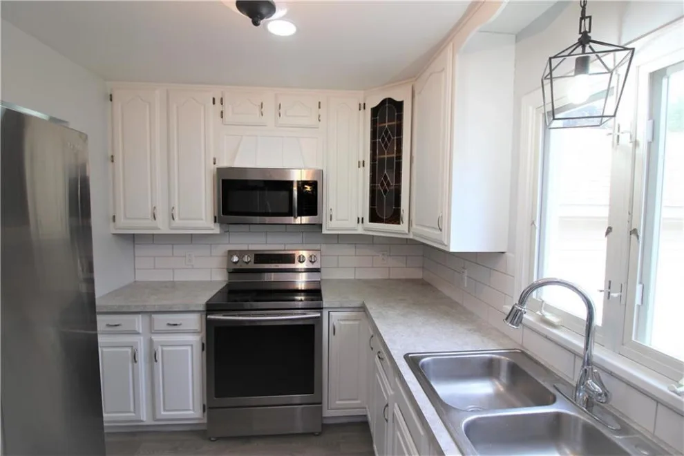 Stunning Rochester Cape Cod Makeover by Arsenal Construction | Custom Builds & Renovations - Photo 10