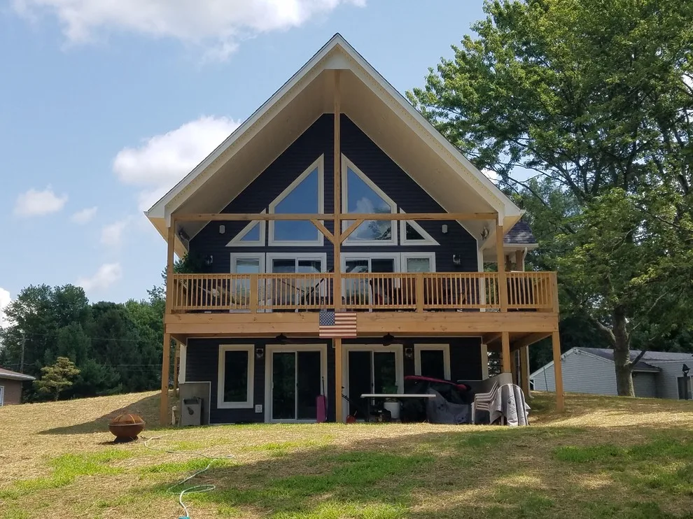 Custom Home with Blue Gable Roof by SDC Custom Homes & Remodeling - Photo 13