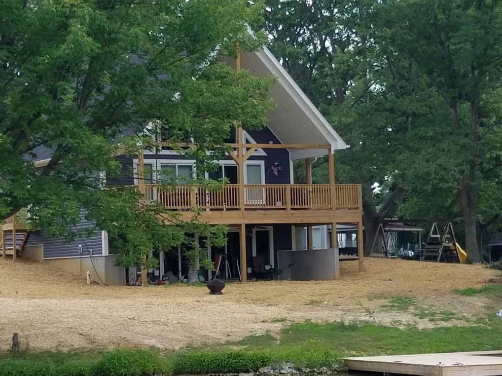 Custom Home with Blue Gable Roof by SDC Custom Homes & Remodeling - Photo 11