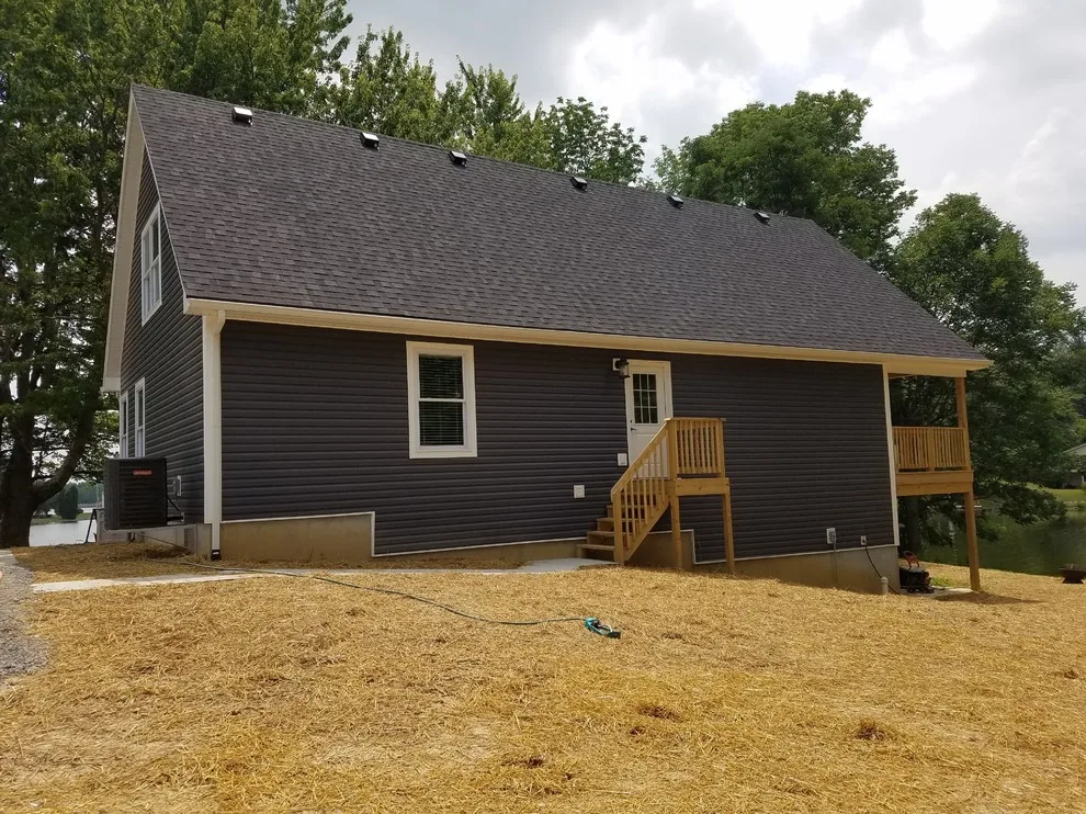 Custom Home with Blue Gable Roof by SDC Custom Homes & Remodeling - Photo 4