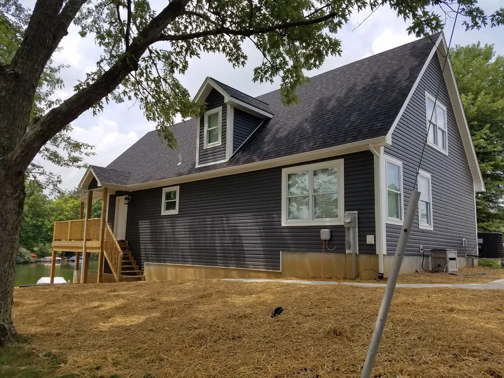Custom Home with Blue Gable Roof by SDC Custom Homes & Remodeling - Photo 6