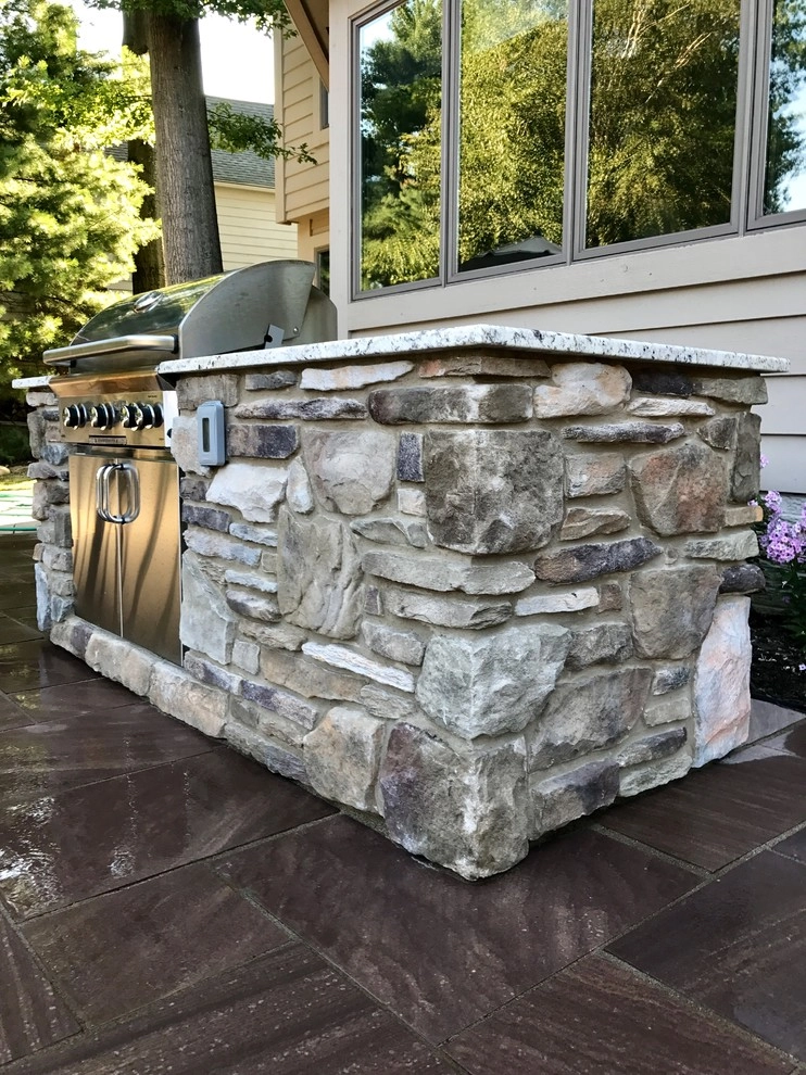 Backyard Retreat - Fire pit and grill station by J. Barker Landscaping Company - Photo 2