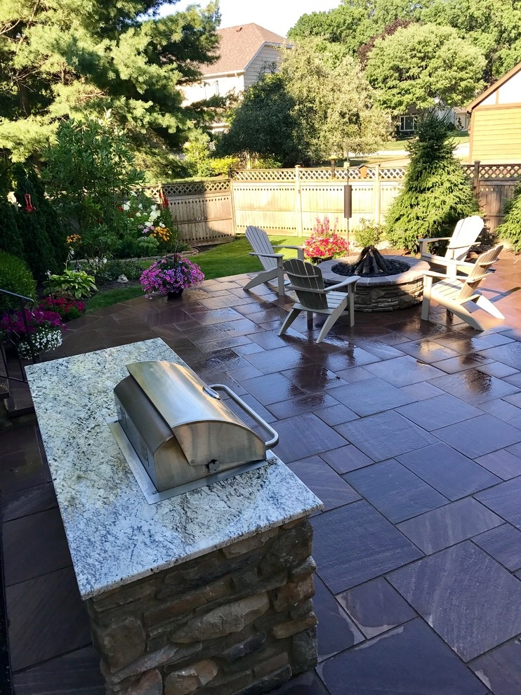 Backyard Retreat - Fire pit and grill station by J. Barker Landscaping Company - Photo 5