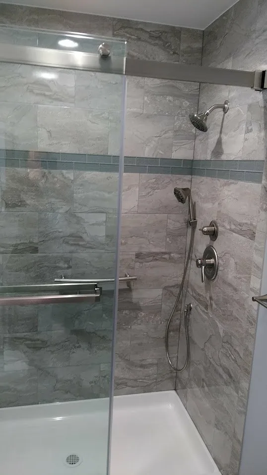 Gray Bathroom Renovation by Clarence by New York Kitchen & Bath - Photo 3