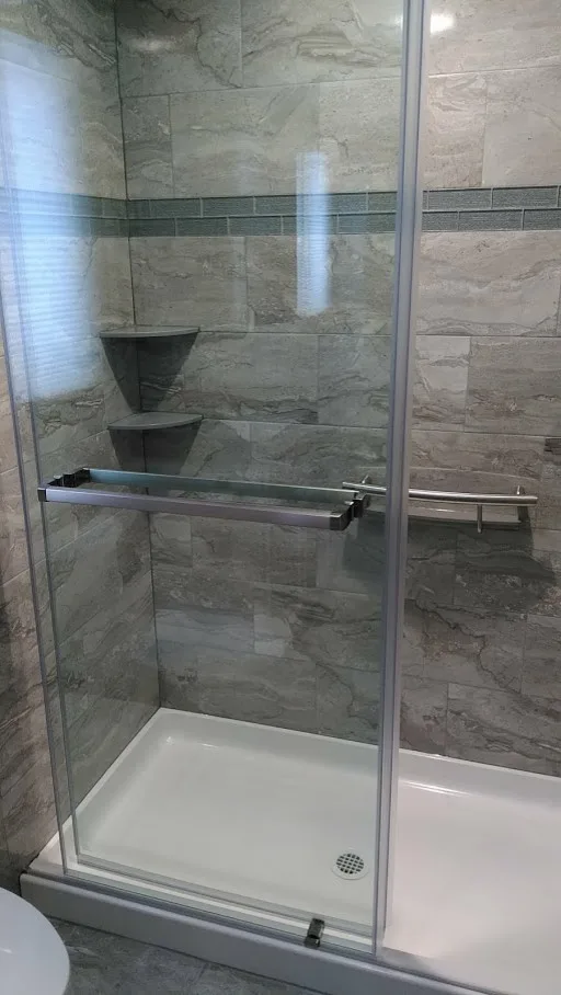 Gray Bathroom Renovation by Clarence by New York Kitchen & Bath - Photo 5
