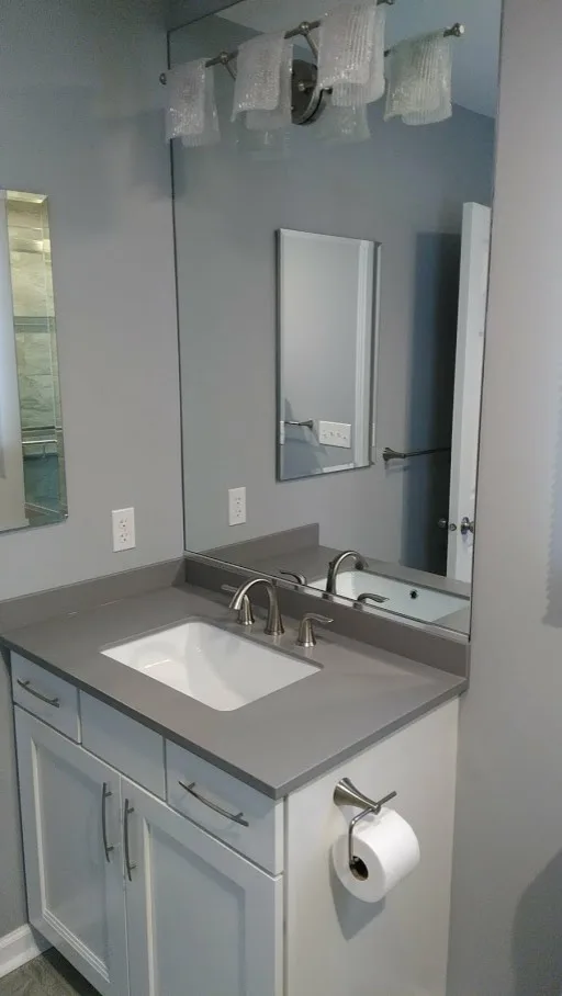 Gray Bathroom Renovation by Clarence by New York Kitchen & Bath - Photo 4