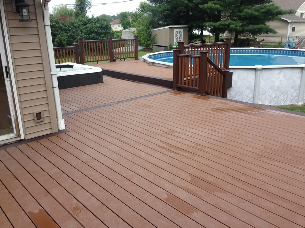 Deck with hot tub and swimming pool by JSR Construction Inc - Photo 5
