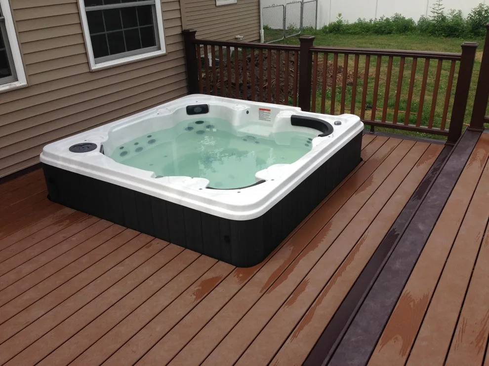 Deck with hot tub and swimming pool by JSR Construction Inc - Photo 4