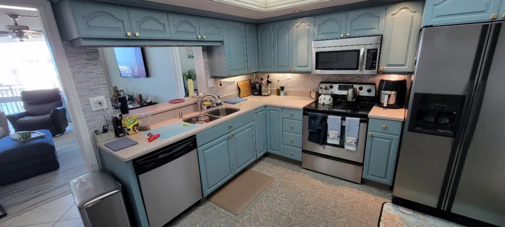 Two-Tone Cabinet Kitchen Remodel in a Condo by Kitchen Solvers Of The Gulf Coast - Photo 4