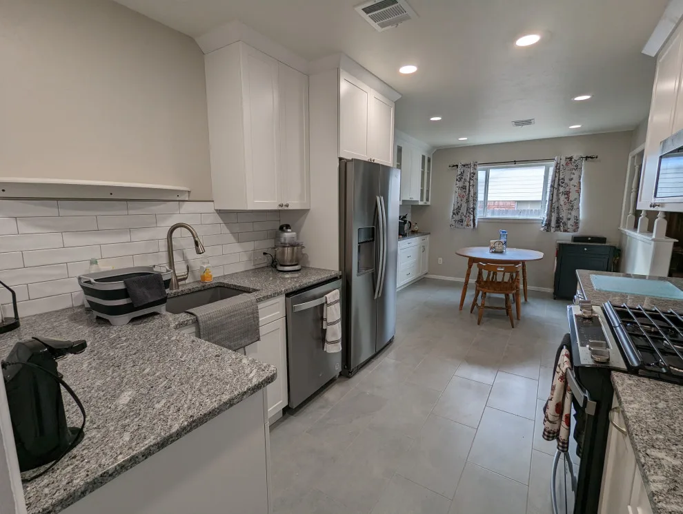Modern Kitchen Renovation Featuring New White Cabinets by Kitchen Solvers Of Oklahoma City - Photo 8