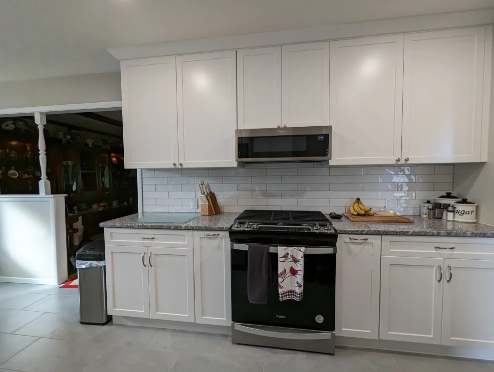 Modern Kitchen Renovation Featuring New White Cabinets by Kitchen Solvers Of Oklahoma City - Photo 7