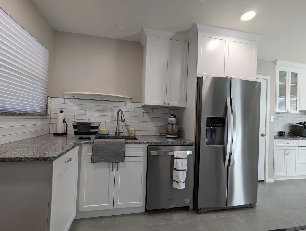 Modern Kitchen Renovation Featuring New White Cabinets by Kitchen Solvers Of Oklahoma City - Photo 10