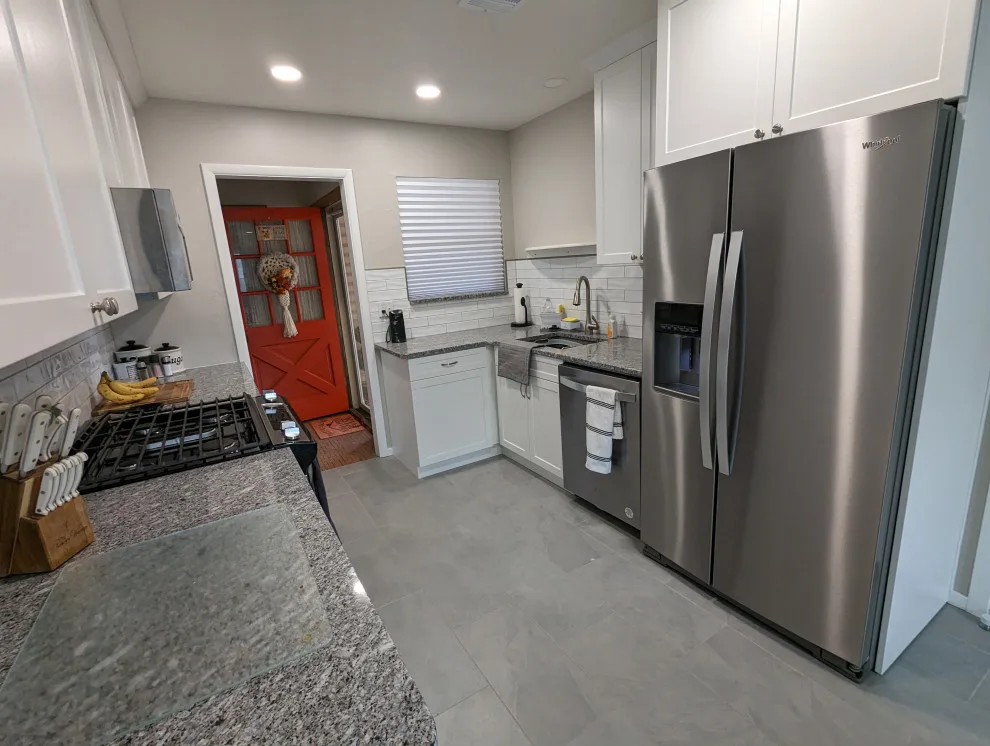 Modern Kitchen Renovation Featuring New White Cabinets by Kitchen Solvers Of Oklahoma City - Photo 11