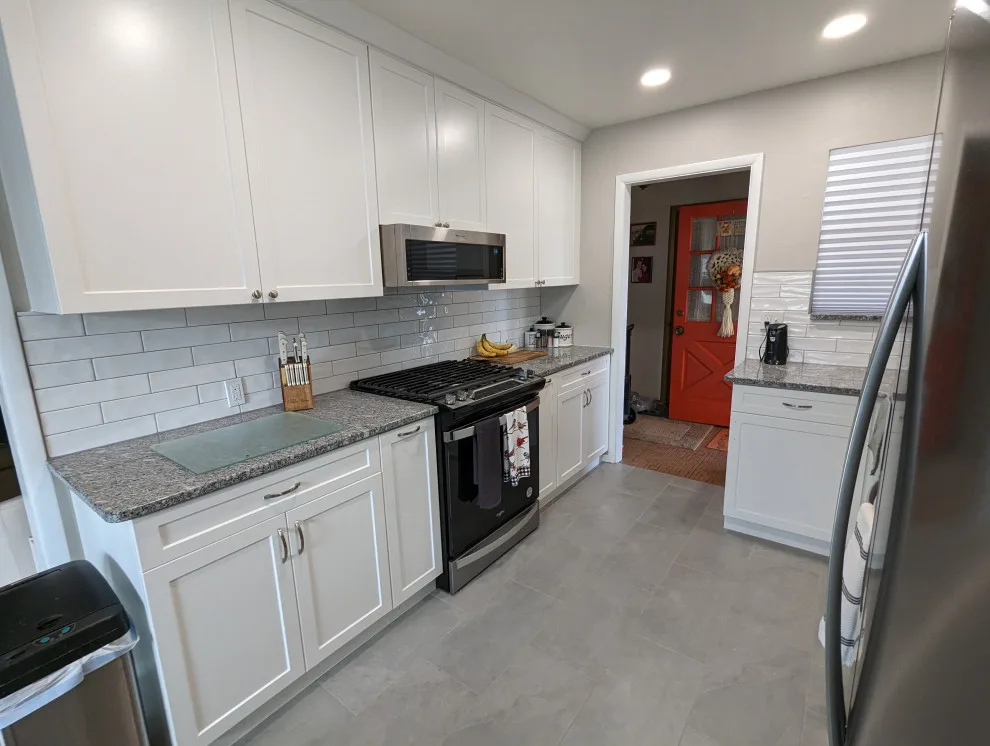Modern Kitchen Renovation Featuring New White Cabinets by Kitchen Solvers Of Oklahoma City - Photo 6