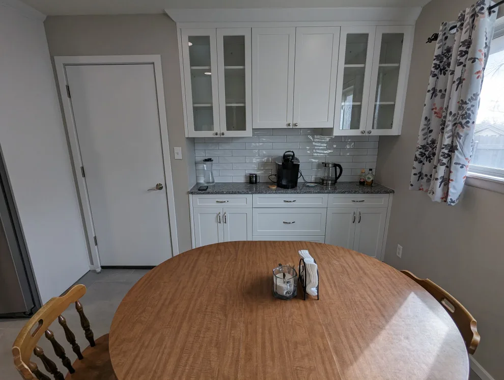 Modern Kitchen Renovation Featuring New White Cabinets by Kitchen Solvers Of Oklahoma City - Photo 3