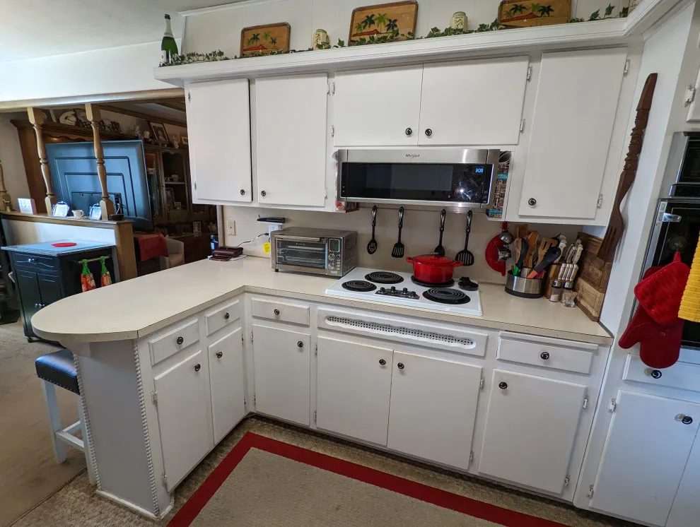 Modern Kitchen Renovation Featuring New White Cabinets by Kitchen Solvers Of Oklahoma City - Photo 9