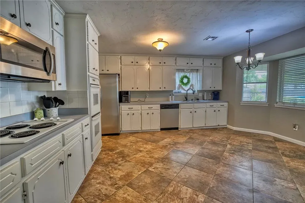 Modern Kitchen Renovation Featuring New Cabinets by Kitchen Solvers Of Oklahoma City - Photo 3