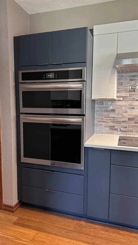 Modern Kitchen Renovation with Dual-Tone Cabinets by Kitchen Solvers Of Oklahoma City - Photo 5