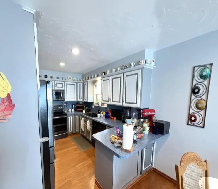 Modern Kitchen Renovation with Dual-Tone Cabinets by Kitchen Solvers Of Oklahoma City - Photo 3