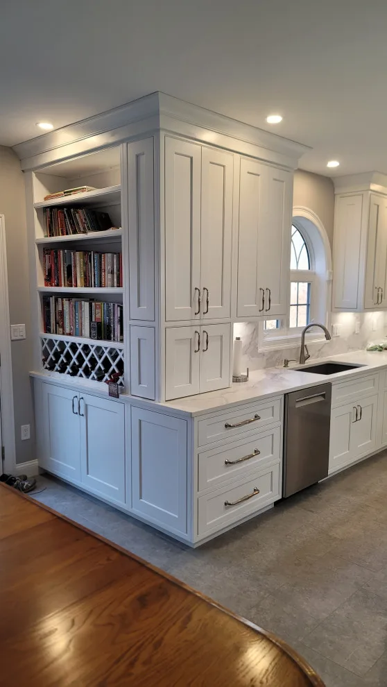 Modern White Kitchen with Waterfall Island by Taylor And Stevens Cabinetry - Photo 4