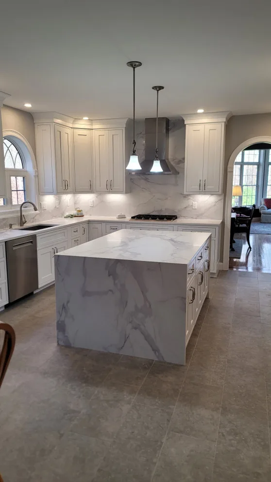 Modern White Kitchen with Waterfall Island by Taylor And Stevens Cabinetry - Photo 5