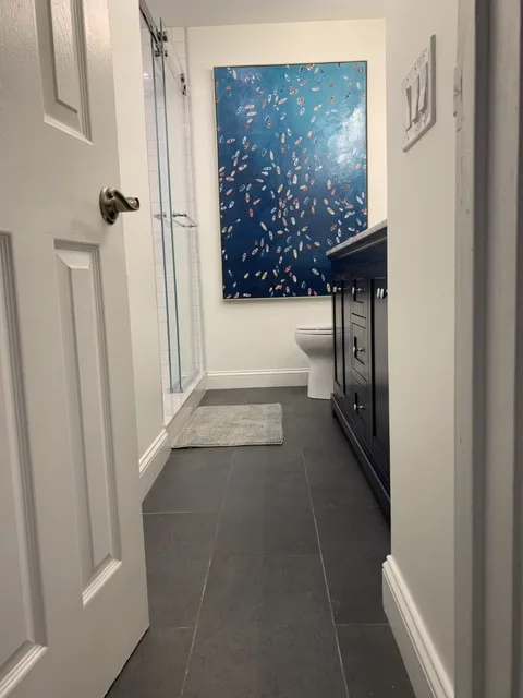 Sleek and Fresh Bathroom Renovation by K & M Flooring-Renovations Inc. - Photo 3
