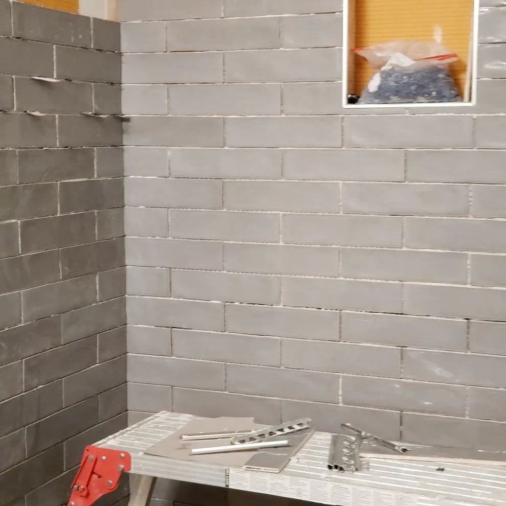 Basement Renovation Featuring Bar Space and Steam Shower by EWC Home Services & Design - Photo 4
