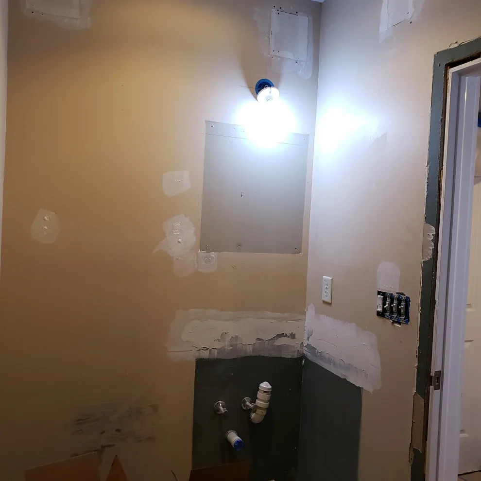 Basement Renovation Featuring Bar Space and Steam Shower by EWC Home Services & Design - Photo 3