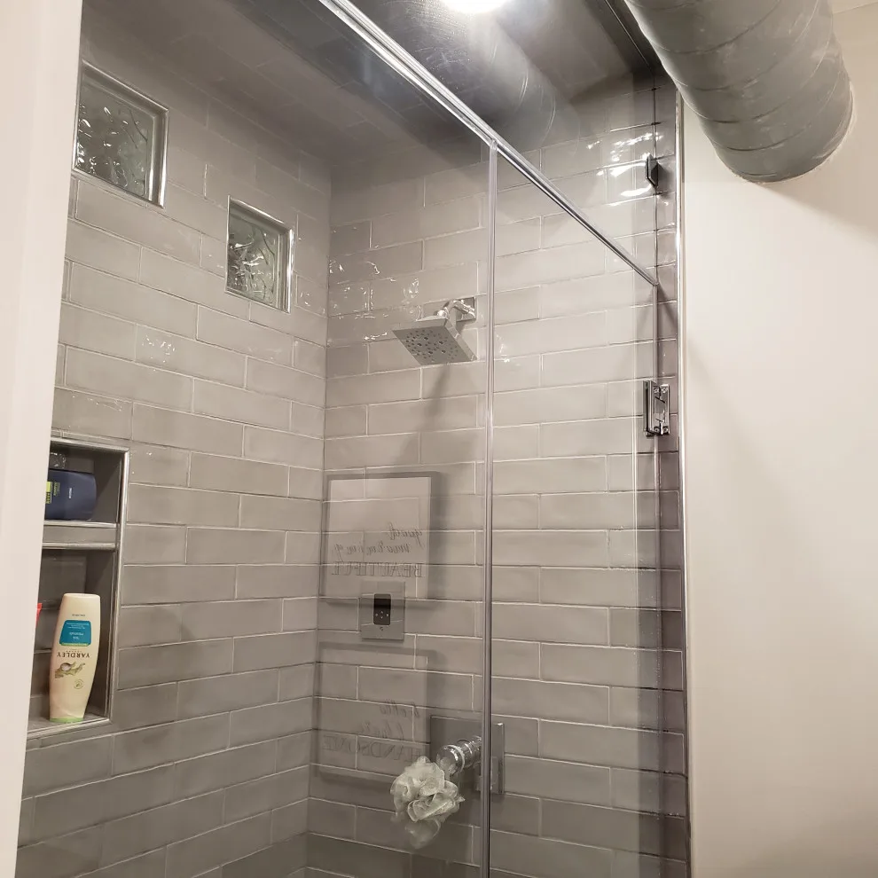 Basement Renovation Featuring Bar Space and Steam Shower by EWC Home Services & Design - Photo 2
