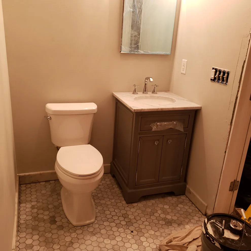Basement Renovation Featuring Bar Space and Steam Shower by EWC Home Services & Design - Photo 15