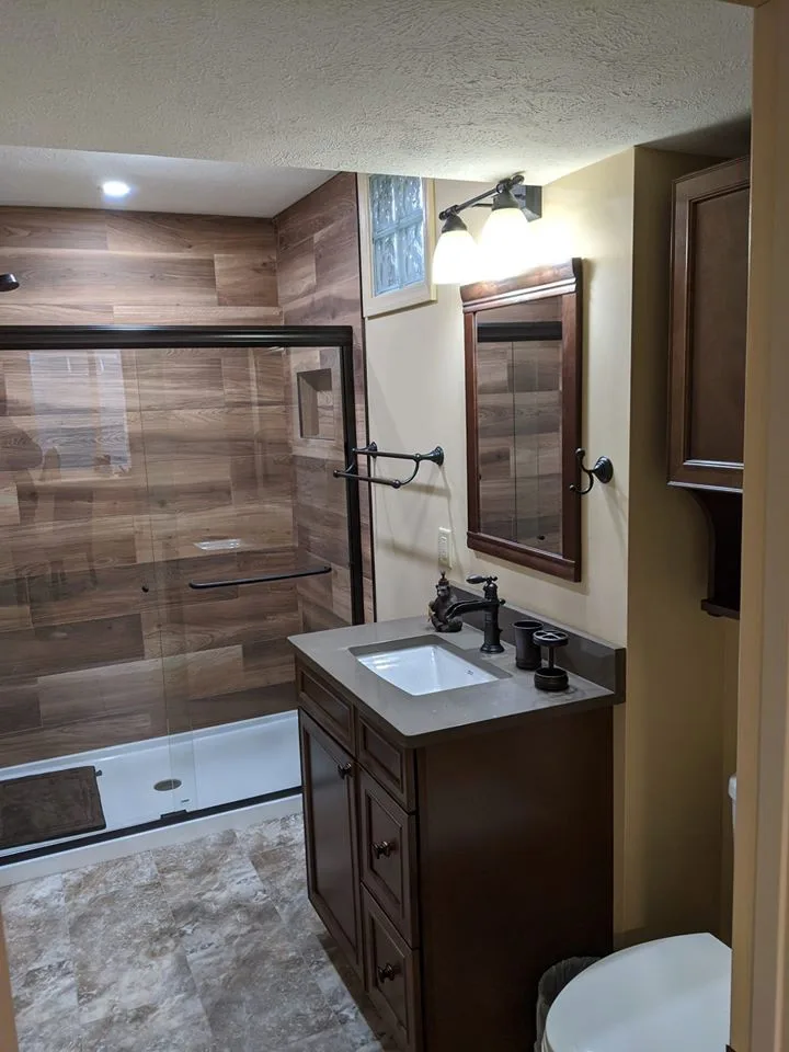 Personalized tiled shower by HM Remodeling - Photo 4