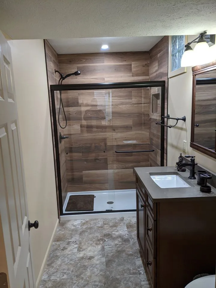 Personalized tiled shower by HM Remodeling - Photo 2