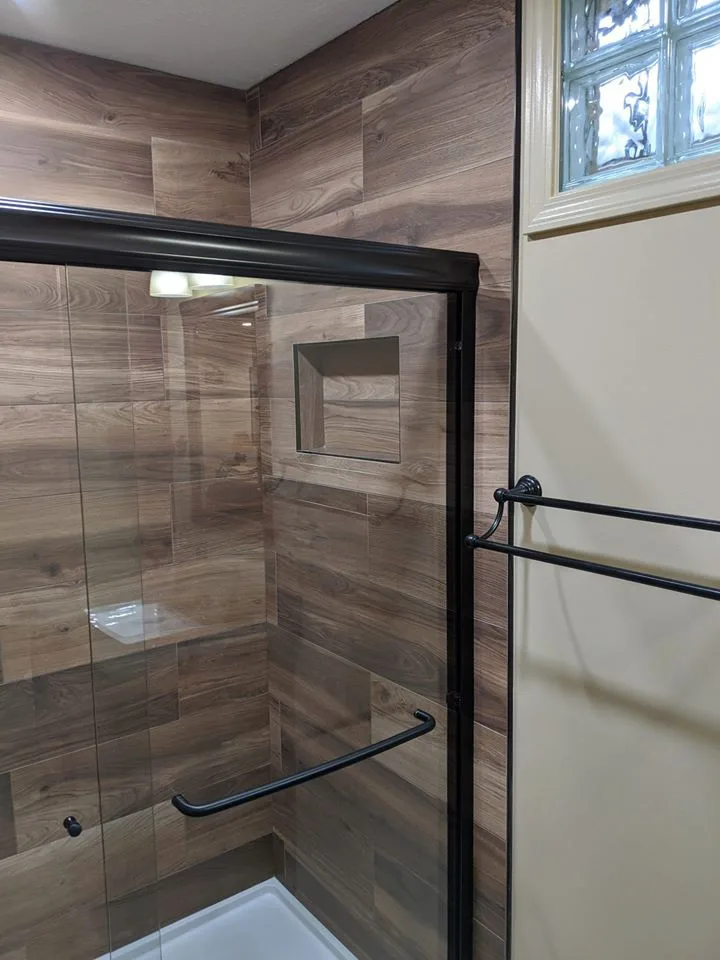 Personalized tiled shower by HM Remodeling - Photo 3