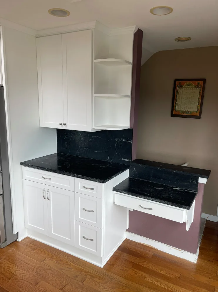 Bespoke White Kitchen Renovation Featuring Black Quartz Countertops by Emerald City Custom Cabinets - Photo 2