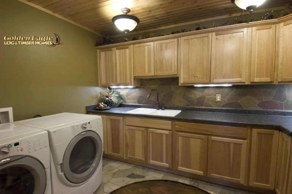 Stylish Laundry by Golden Eagle Log & Timber Homes - Photo 13