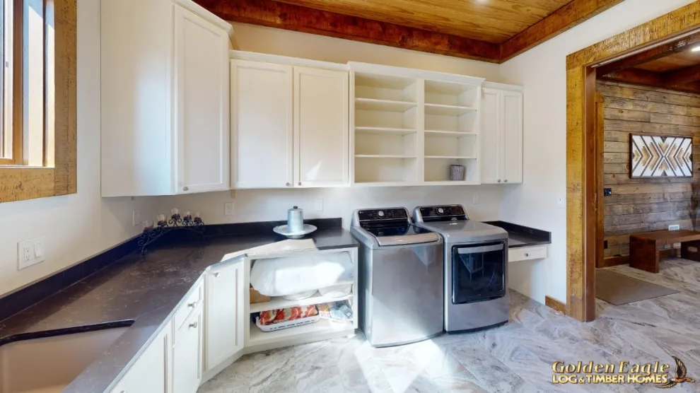 Stylish Laundry by Golden Eagle Log & Timber Homes - Photo 15