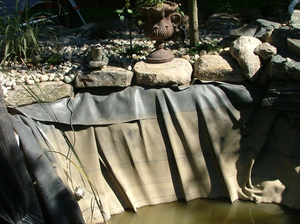 Main driveway with koi ponds on both sides . by Koi Villa Water Garden Center - Photo 17
