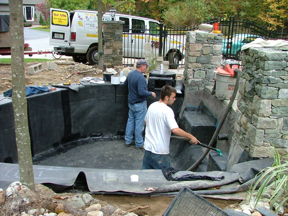 Main driveway with koi ponds on both sides . by Koi Villa Water Garden Center - Photo 28