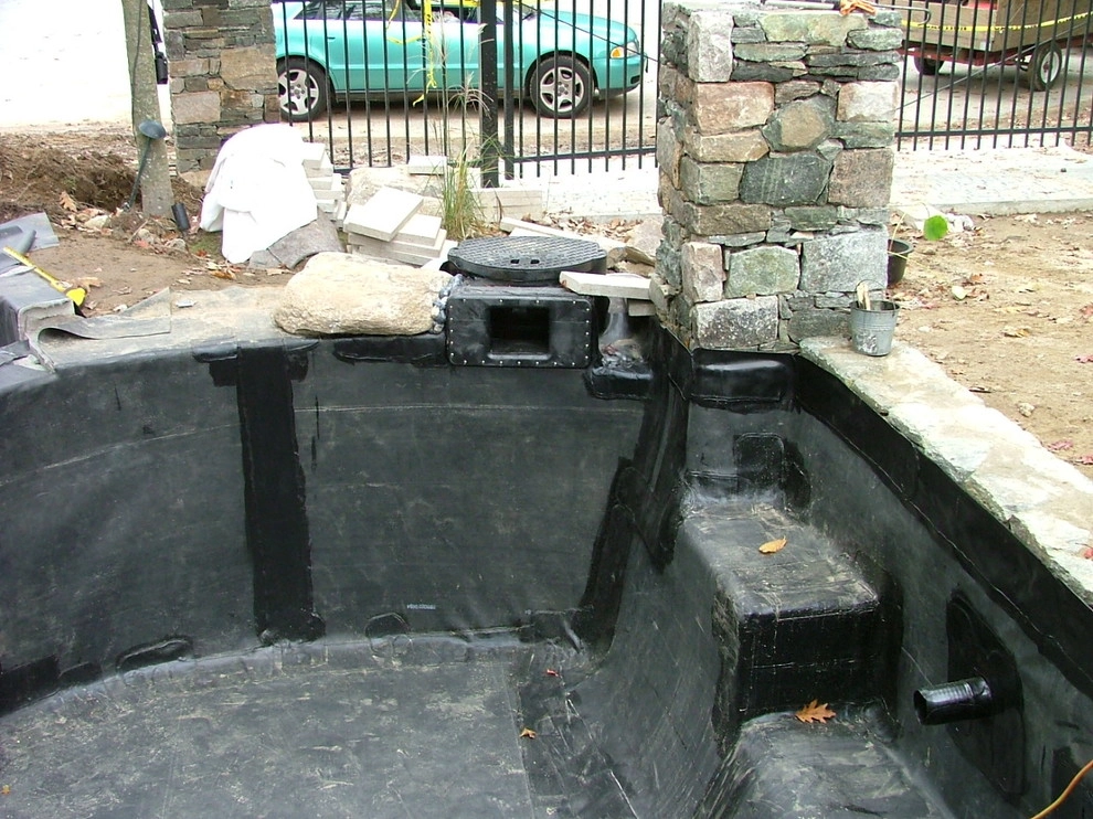 Main driveway with koi ponds on both sides . by Koi Villa Water Garden Center - Photo 22